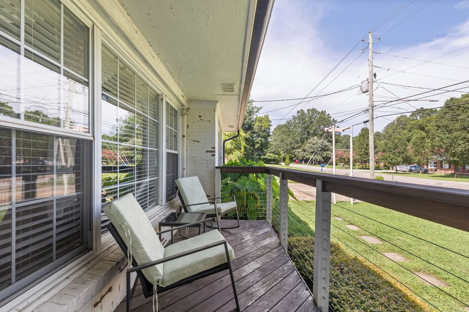 Unwind on the private balcony overlooking serene views complete with cozy seatin