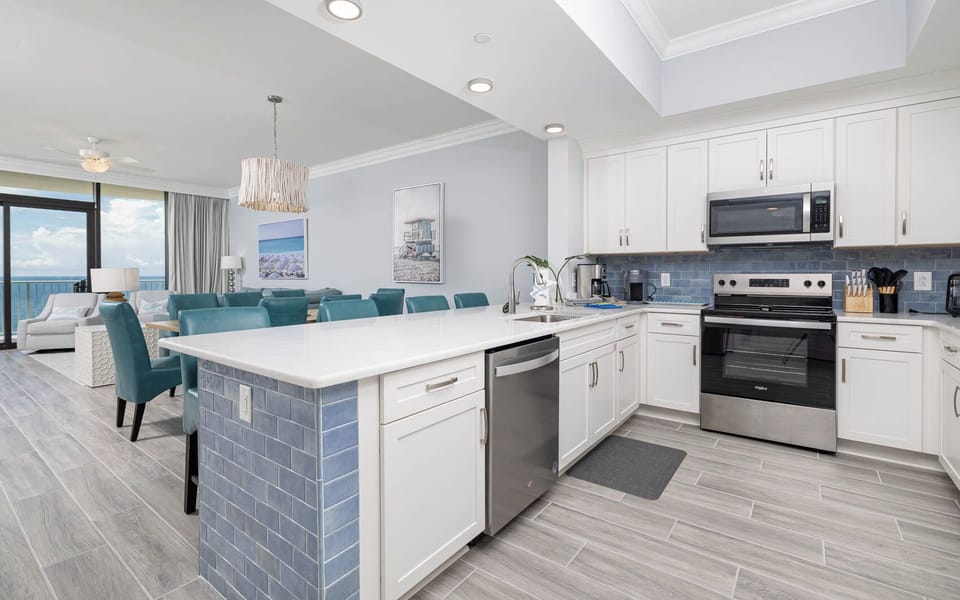 Enjoy cooking meals in this stylish kitchen with stainless appliances and elegant tile accents
