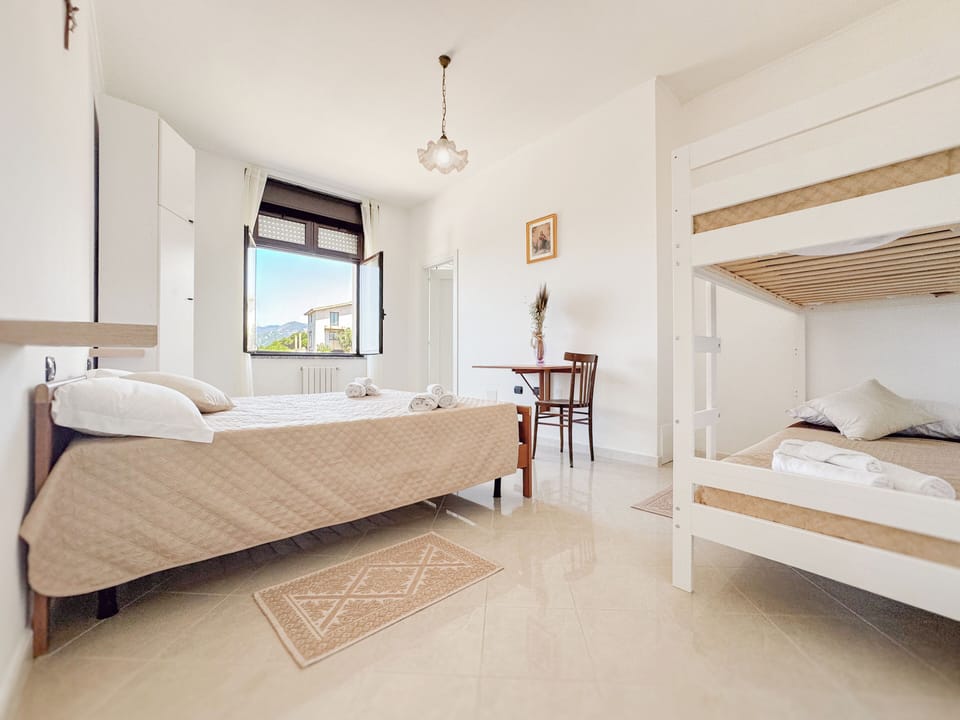 Standard Quadruple Room | Memory foam beds, desk, laptop workspace, blackout drapes