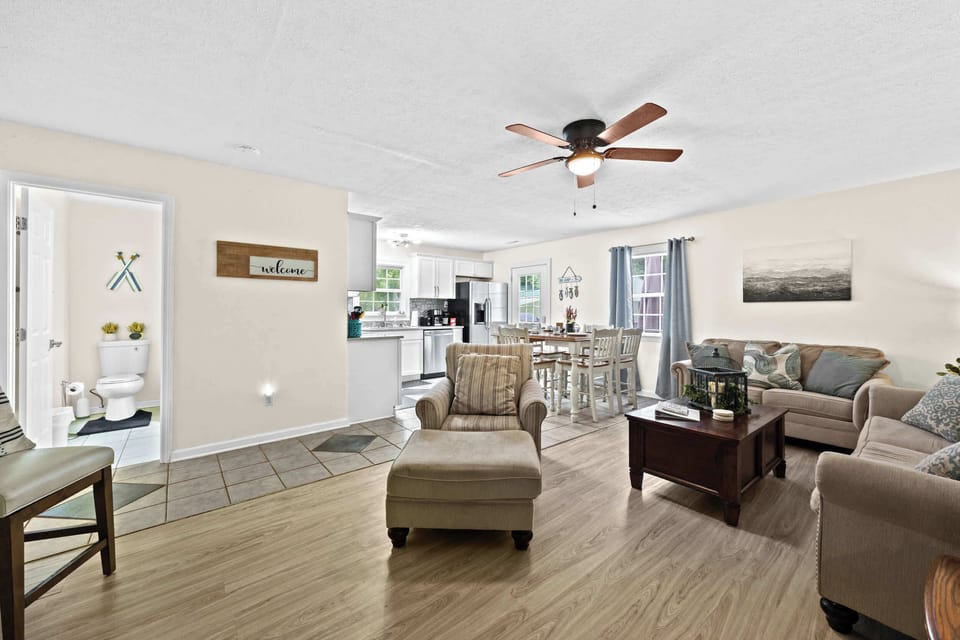 Living Room: Sink into comfort. This inviting living room is the perfect spot to gather, chat, or simply put your feet up