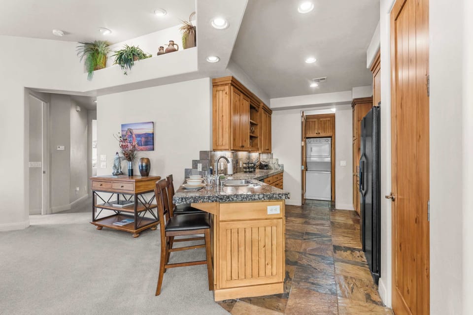 The elegant kitchen offers ample space & every home comfort​