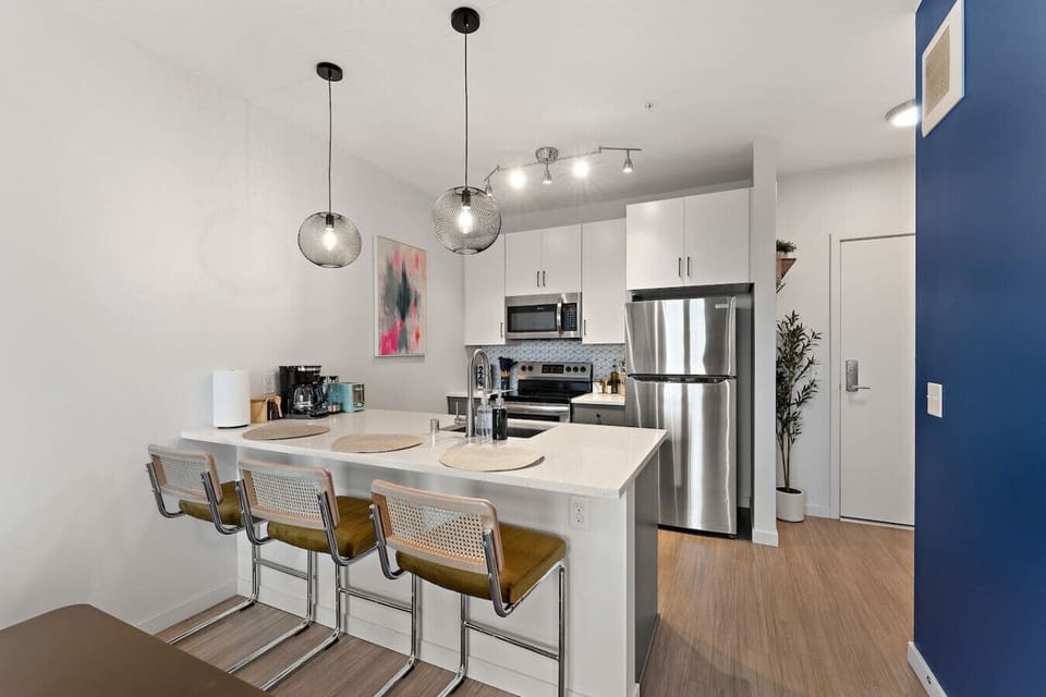 Modern design and sleek appliances create a vibrant setting for delicious meals!