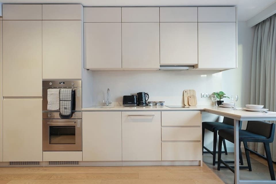 Kitchen equipped with all essentials, including, oven, fridge and full cookware set.
