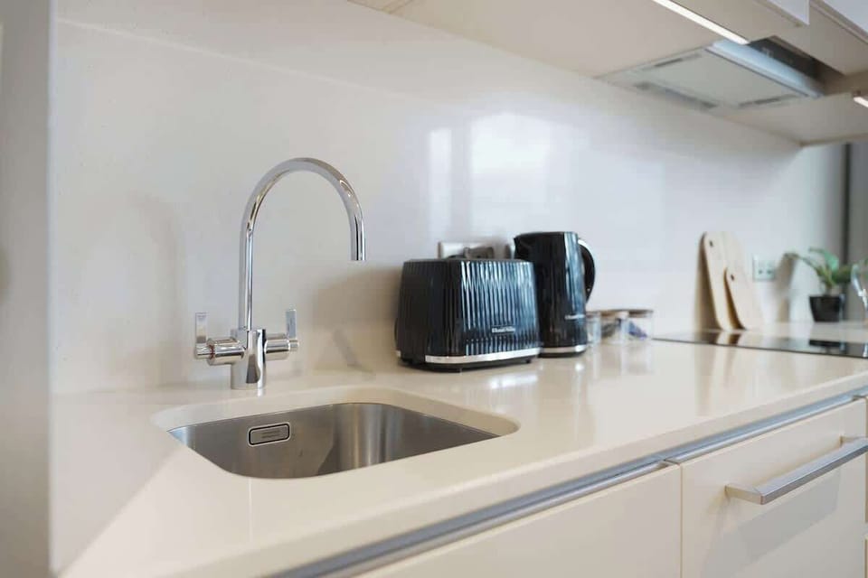 Kitchen equipped with all essentials, including, oven, fridge and full cookware set.