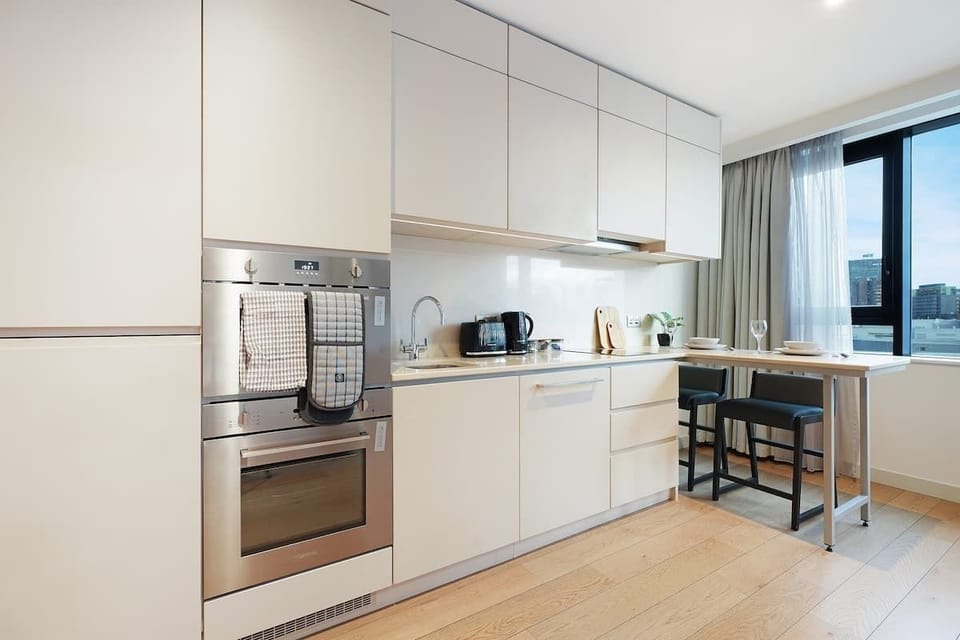 Kitchen equipped with all essentials, including, oven, fridge and full cookware set.