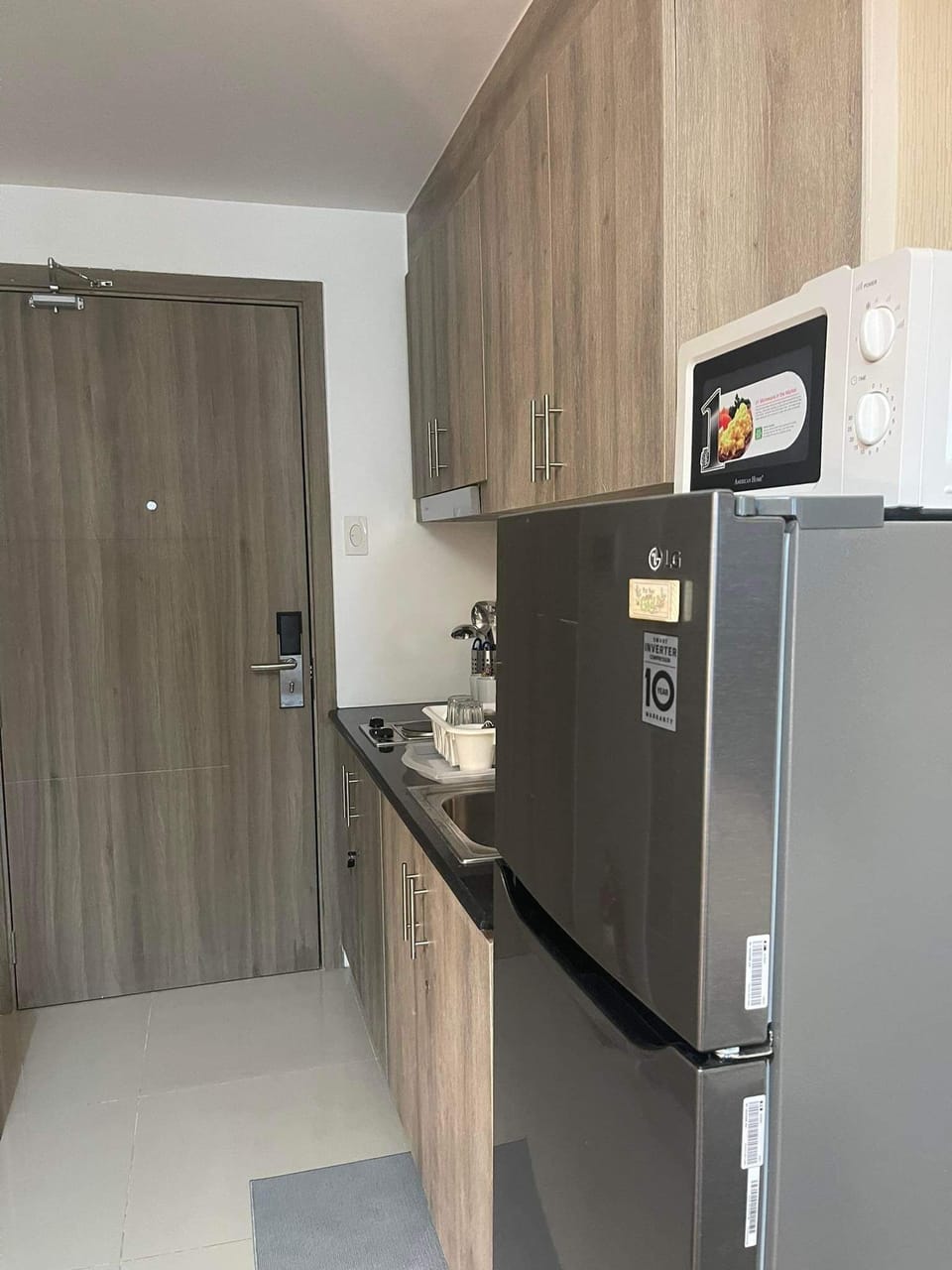 Basic Condo, 1 Bedroom, Balcony, Pool View | Private kitchen | Full-size fridge, microwave, stovetop, rice cooker