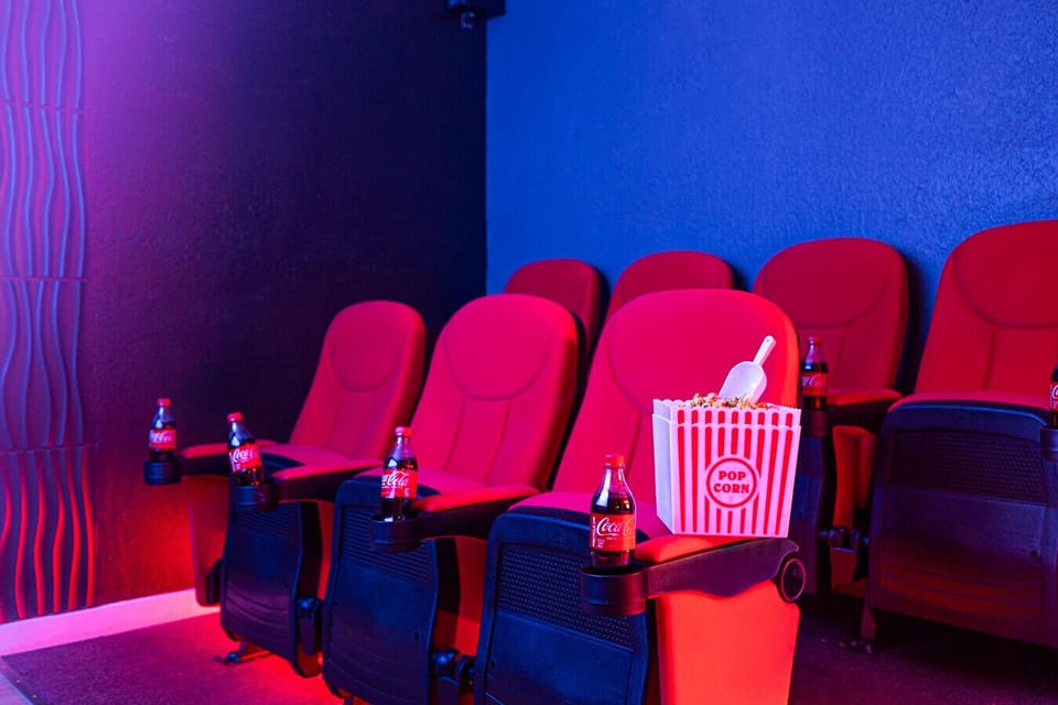 Home Theater Oasis: Enjoy movie nights in plush seating with popcorn and sodas at your fingertips!