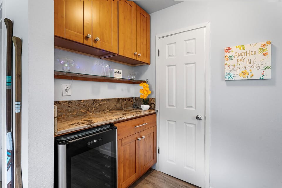 Bar area with wine cooler.