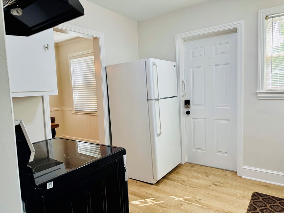 Fully equipped Kitchen with small appliances like Keurig coffee maker, CrockPot, blender and toaster.