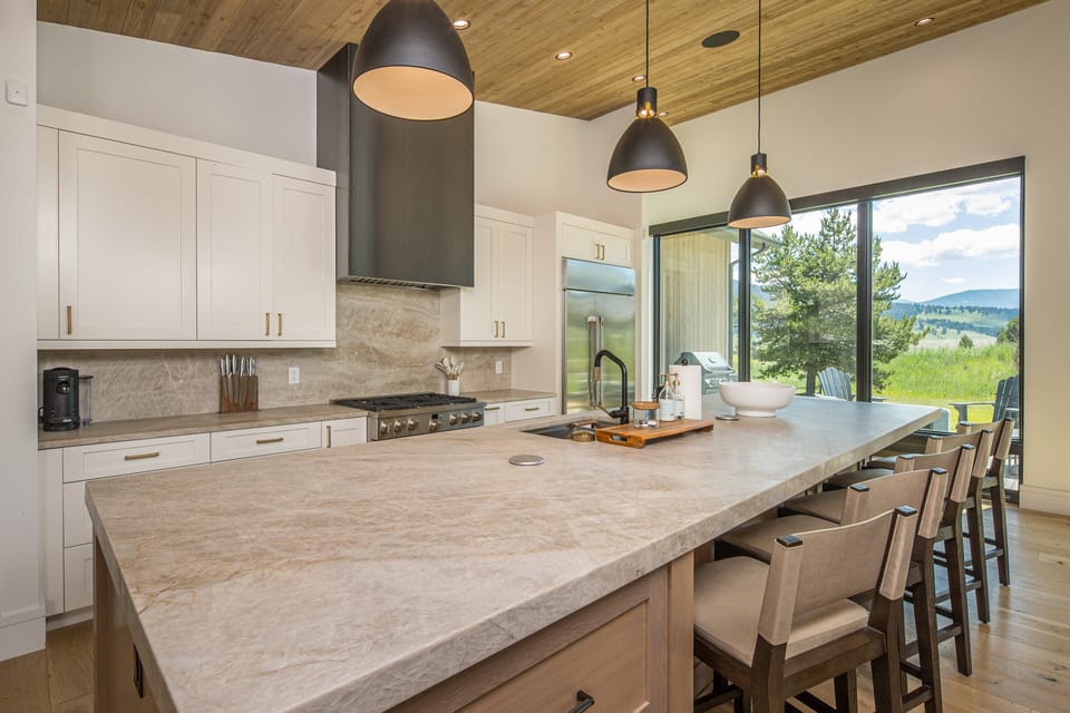 Beautiful kitchen on the main level with plenty of seating and space for amazing meal creations!