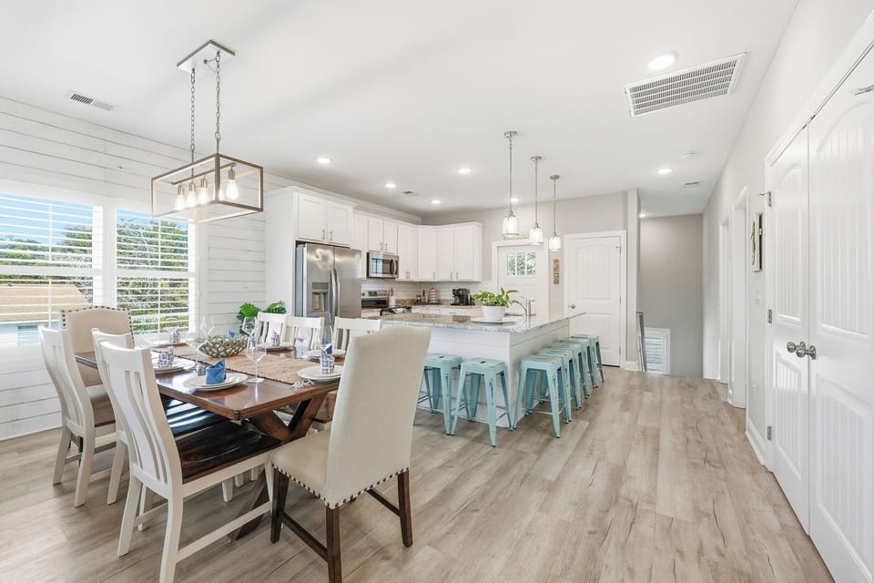 Open dining space seamlessly connected to kitchen and living room