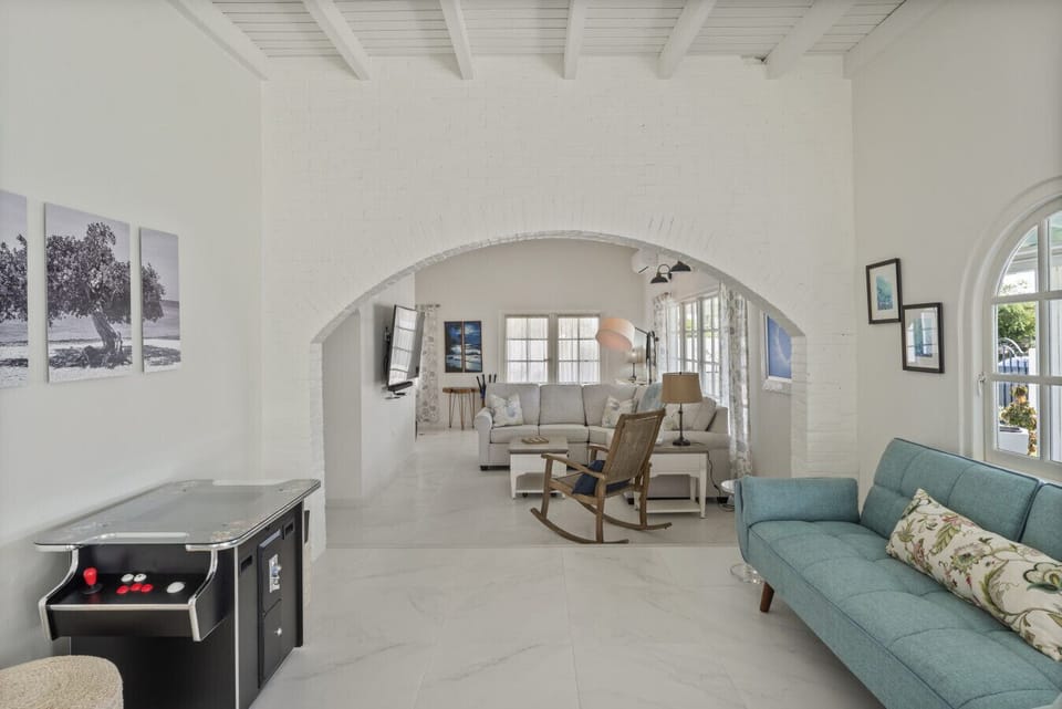 The open-plan living room connects beautifully to the rest of the home, creating a welcoming social hub.