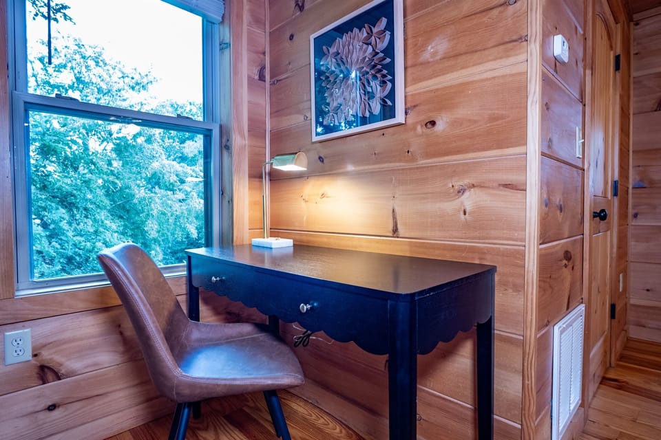 A bright and inspiring desk area in the primary bedroom, allowing you to stay connected or simply enjoy the view.