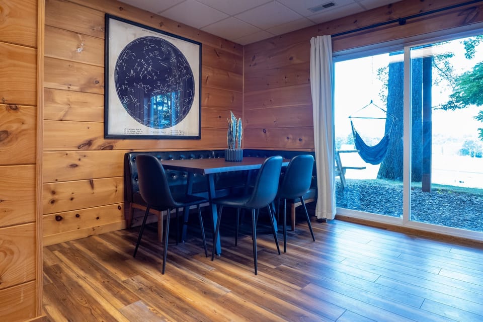 Another inviting spot to relax and enjoy company on the lower level with easy access to outdoor views.