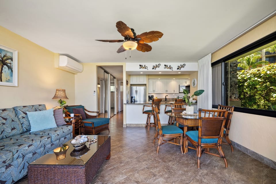 Open-concept living and dining with tropical flair.