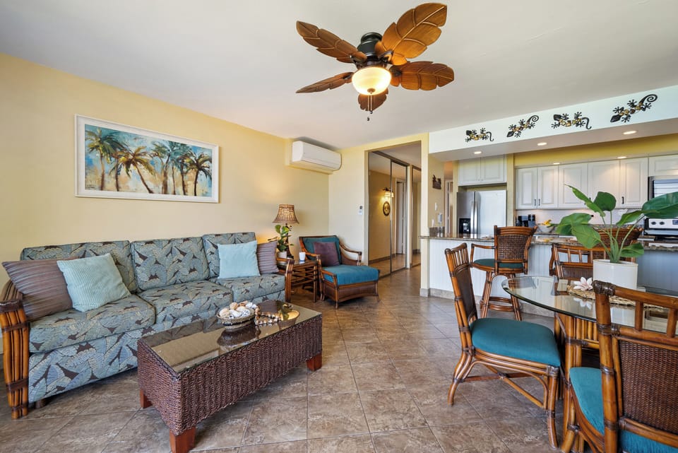 Well-lit interior with stylish furniture and beach-themed artwork.