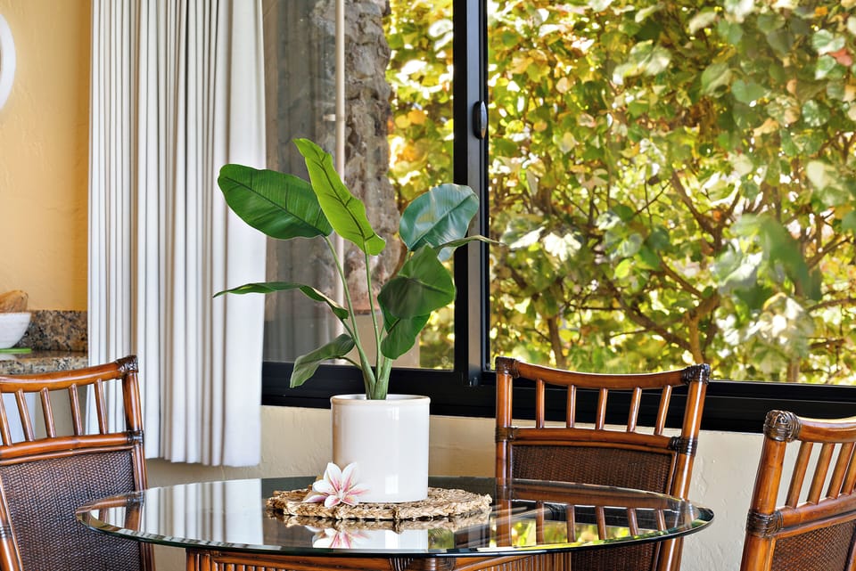 Bright and airy dining area with scenic outdoor views.