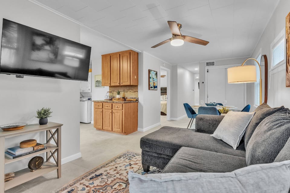 Open living room featuring a 43” Vizio Smart TV