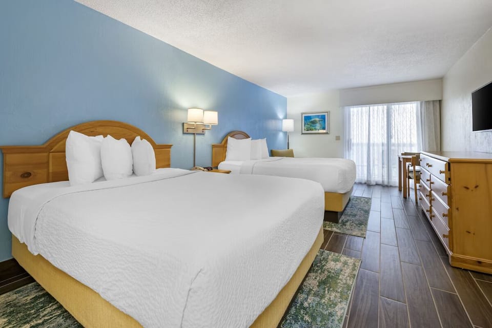 Stretch out on crisp beds in a bright, airy room.