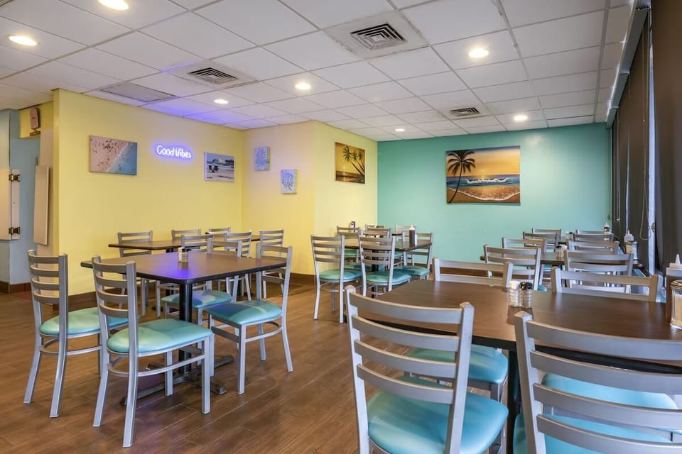 Gather for relaxed bites in a bright, breezy dining room.