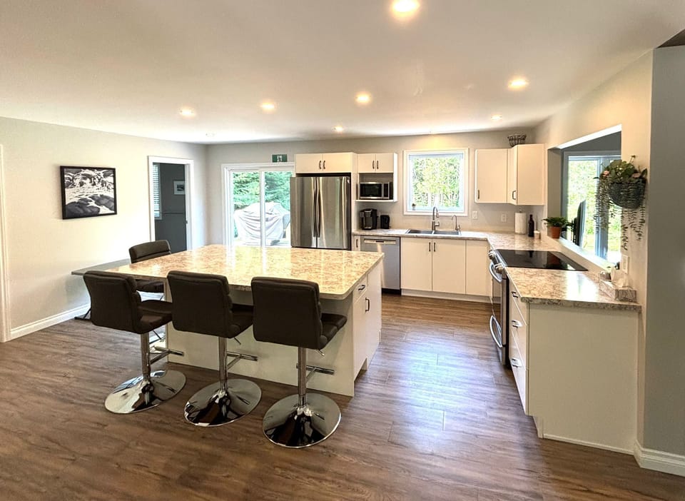Another look at the kitchen’s open layout—bright, functional, and designed for connection.