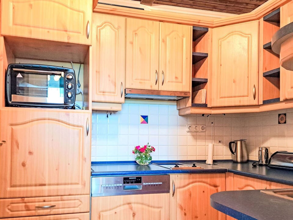 Cabinetry, Wood, Kitchen, Interior Design, Kitchen Appliance, Countertop, Flooring, Major Appliance, Drawer, Cupboard