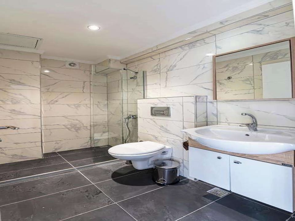 Shower, hair dryer, slippers, towels