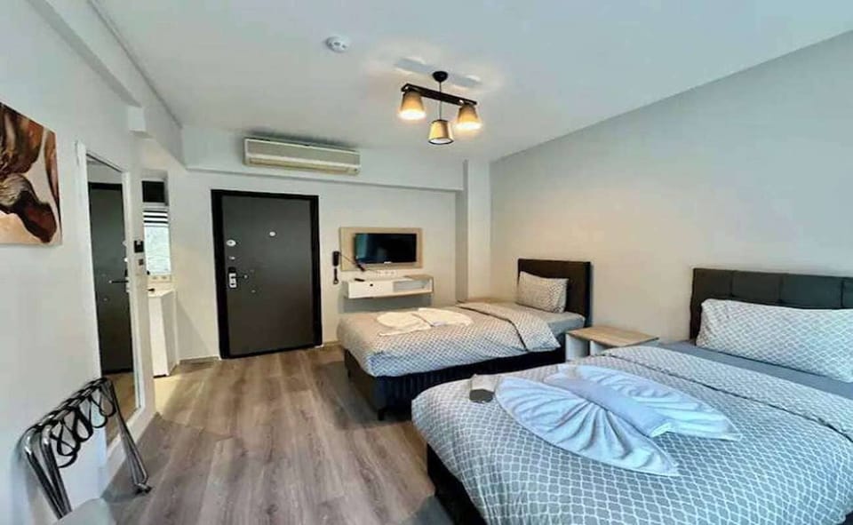 Family Quadruple Room | Premium bedding, down comforters, minibar, in-room safe