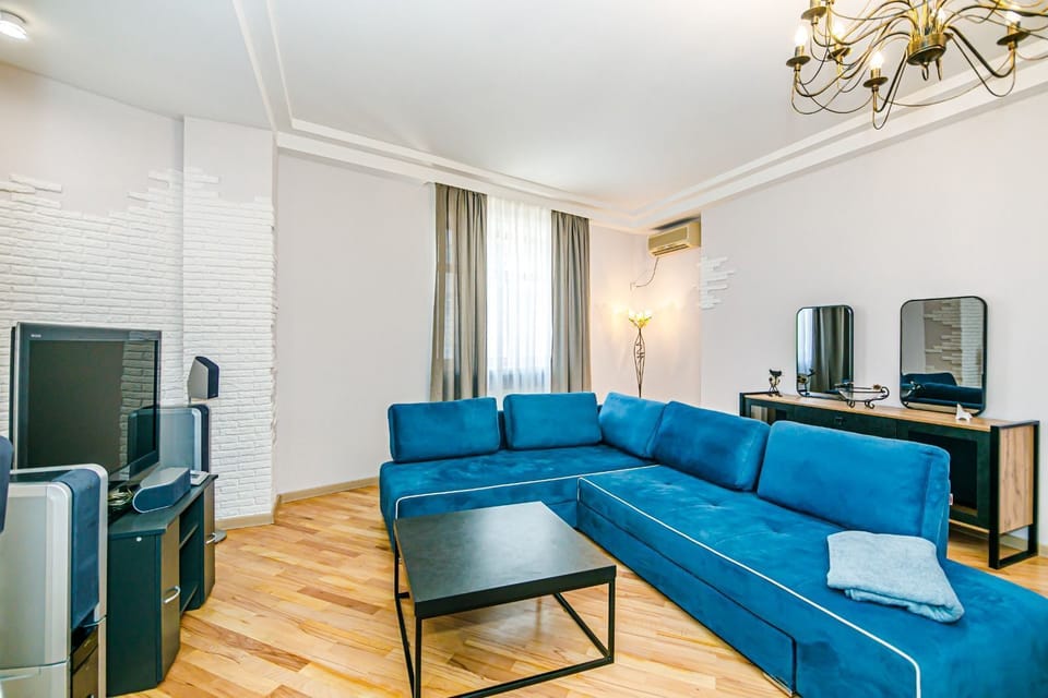 Luxury Apartment, Balcony, Sea View | Living area | 109-cm LED TV with cable channels, heated floors