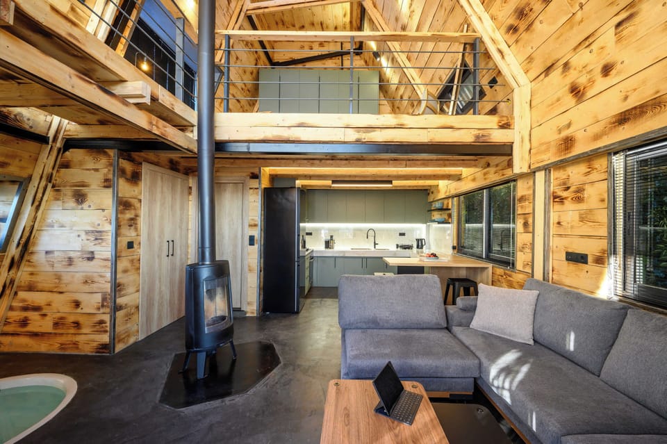 Spacious and inviting lounge with high ceilings and rustic charm