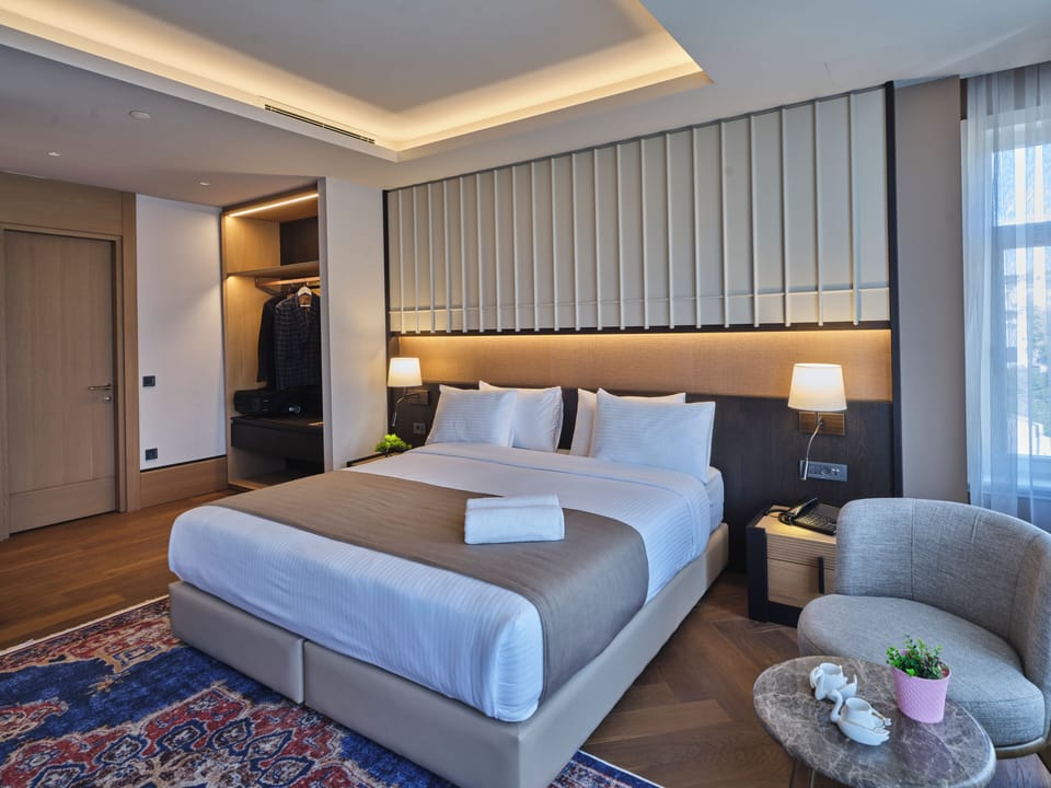 Superior Double Room, City View | In-room safe, desk, laptop workspace, iron/ironing board