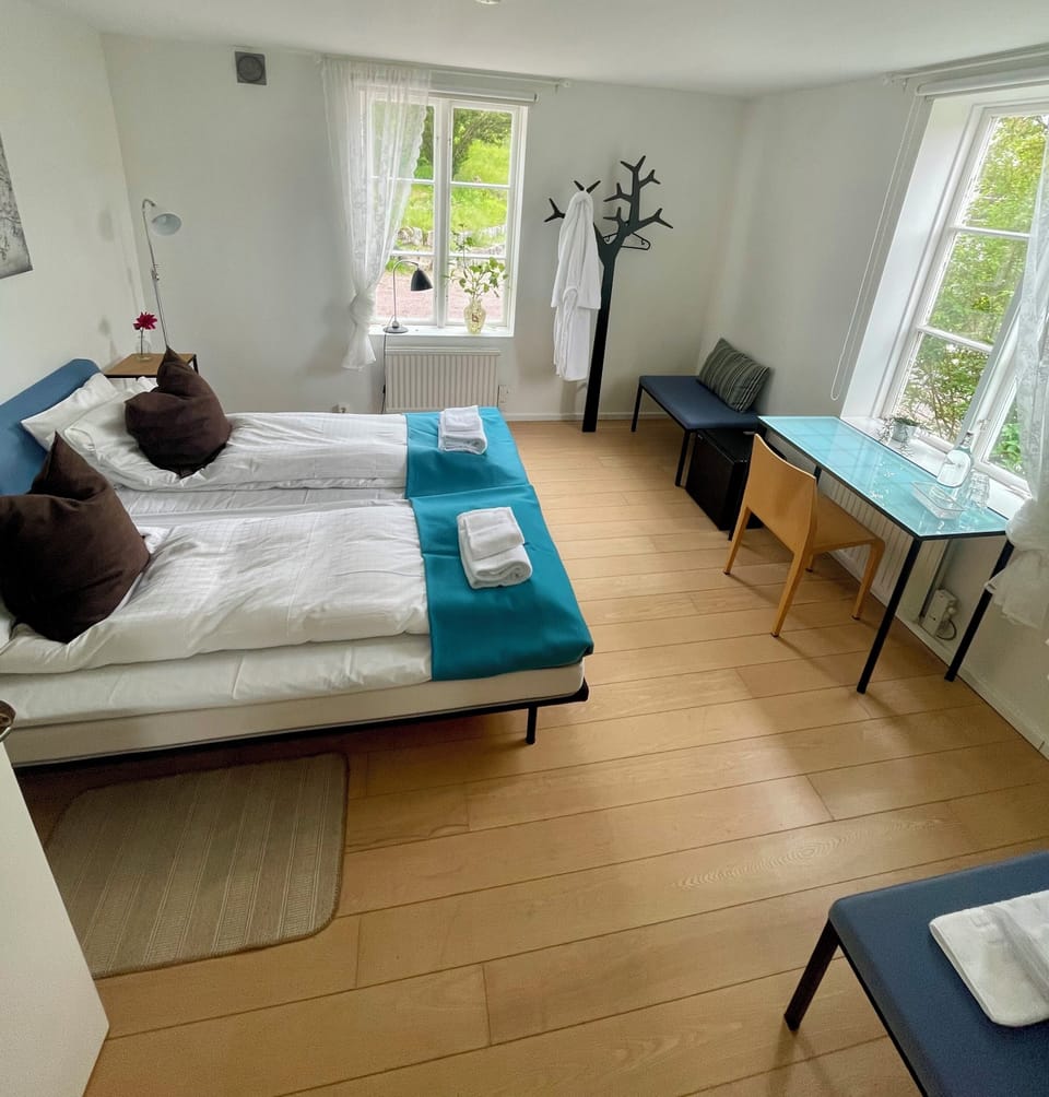 Premium bedding, laptop workspace, bed sheets
