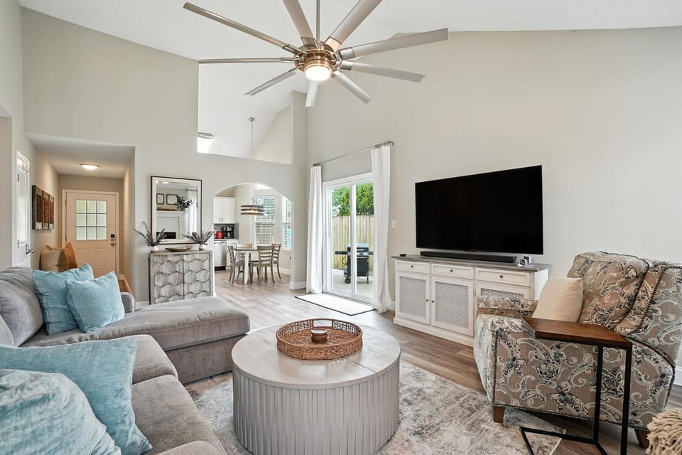 Living Room with Sectional, Smart TV, & Fireplace