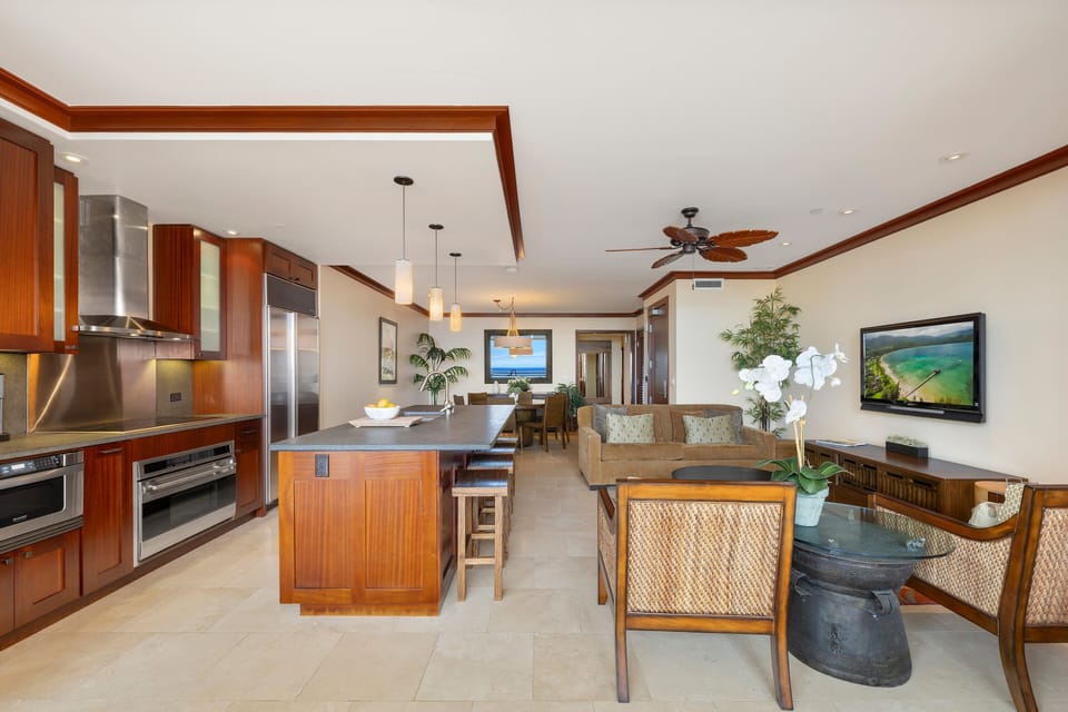 Open-concept layout flows from entry to breezy lanai.