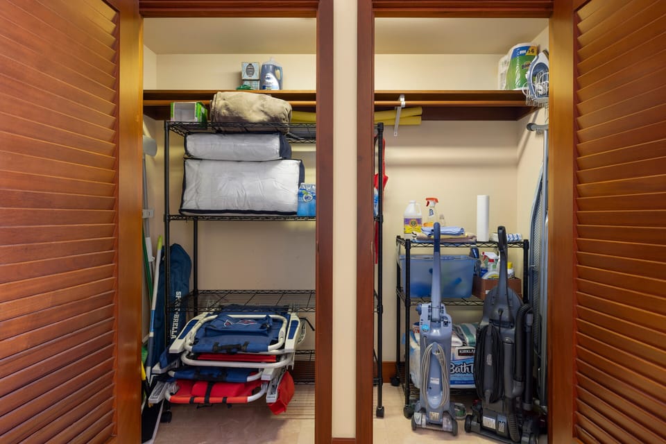 Hall closet stocked with beach gear and snorkels.
