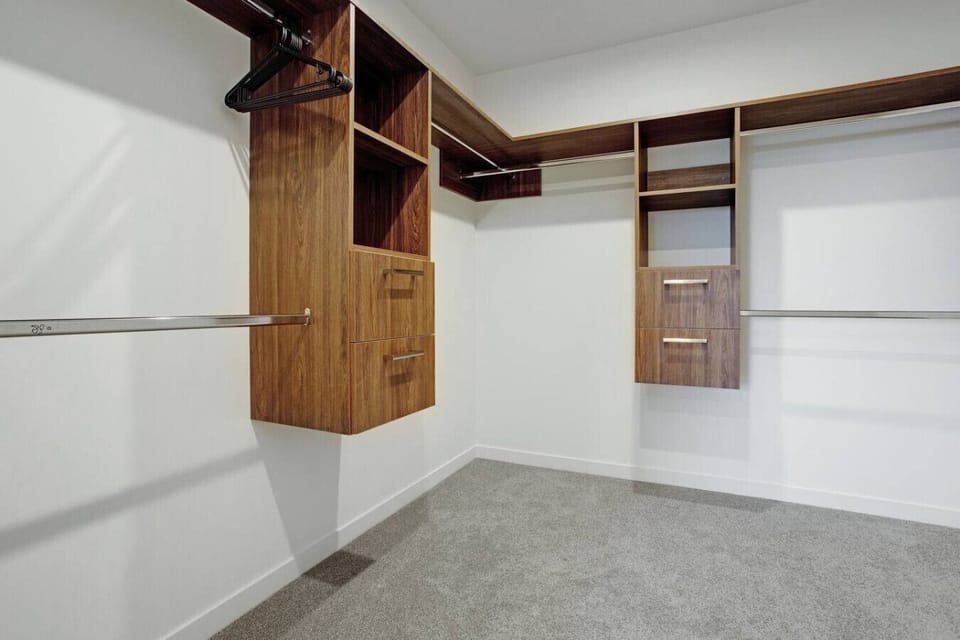 The walk-in wardrobe has plenty of storage space for all your personal belongings.