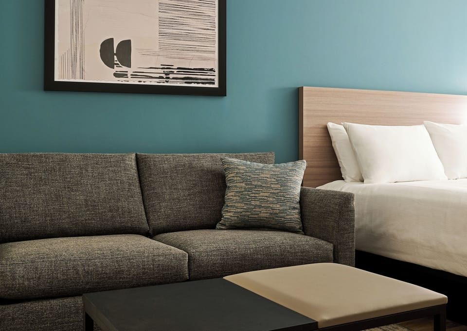 Suite (2 kingbed w Sofabed) | In-room safe, desk, laptop workspace, blackout drapes