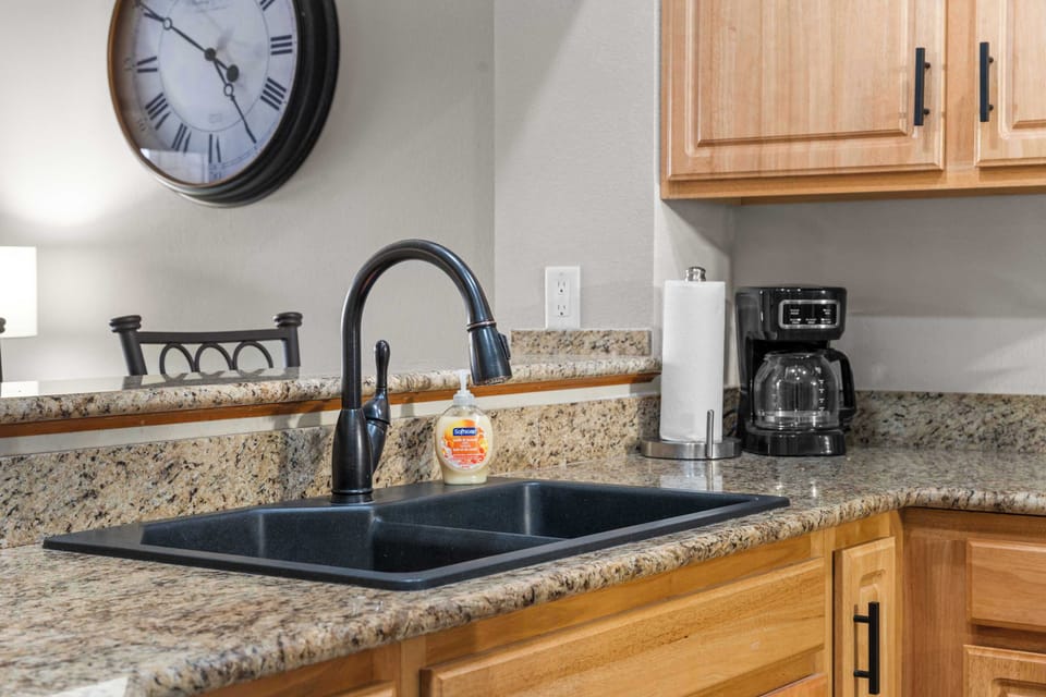 The elegant open kitchen offers ample space & every home comfort​