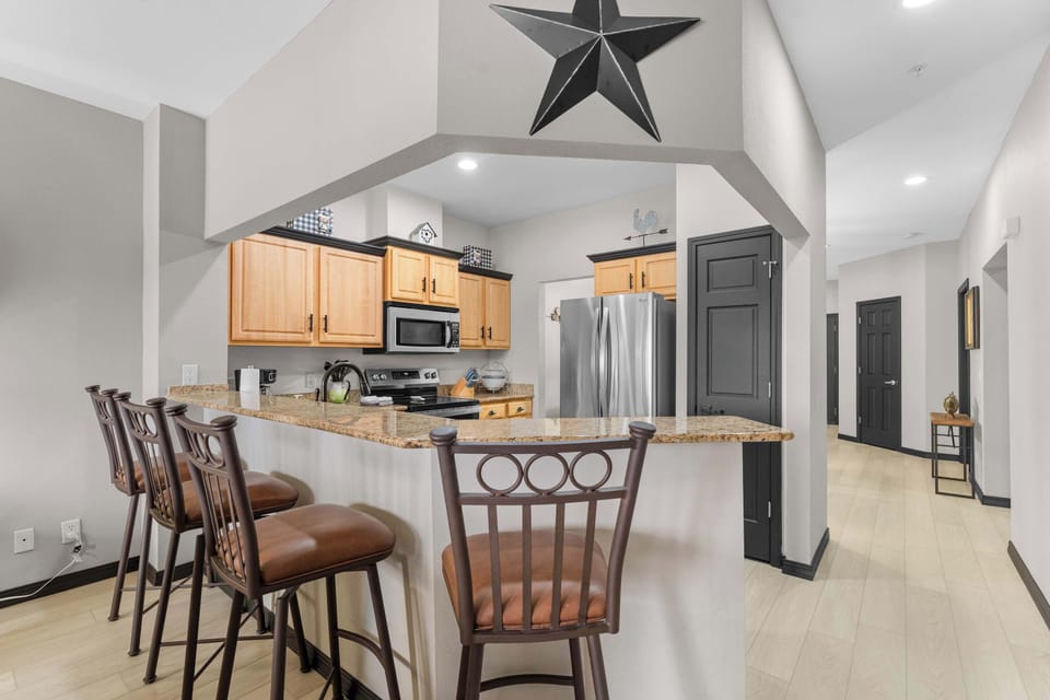 The elegant open kitchen offers ample space & every home comfort​