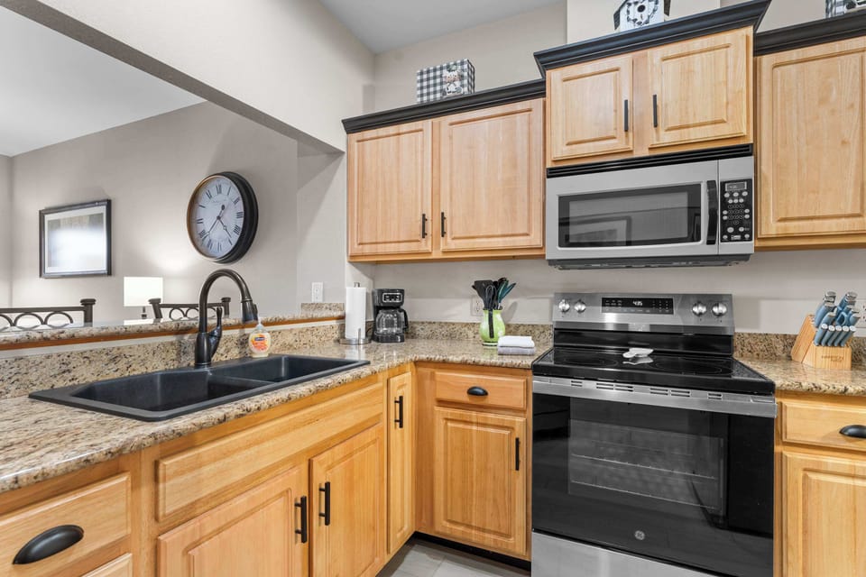 The elegant open kitchen offers ample space & every home comfort​