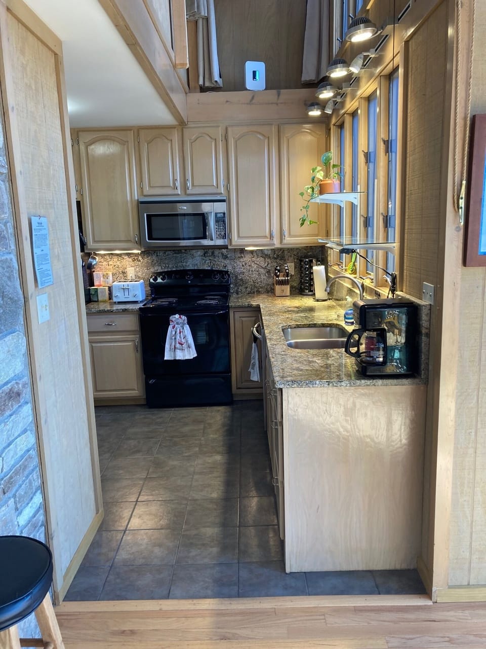 Fully stocked kitchen with sharp knives and a new spice rack.