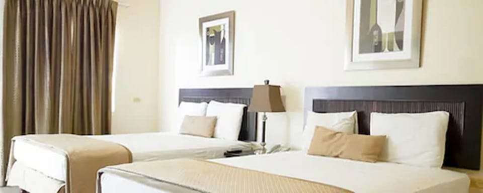 Family Room, 2 Queen Beds | Iron/ironing board, WiFi (free), bed sheets