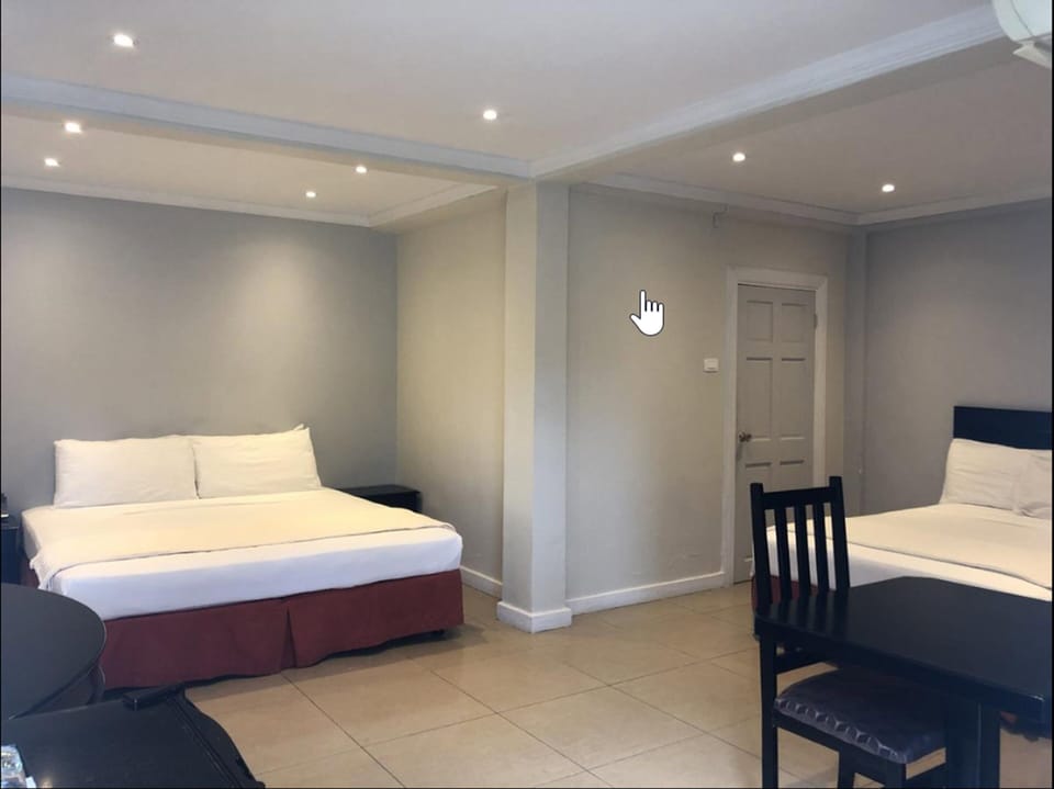 Family Room, 2 Queen Beds | Iron/ironing board, WiFi (free), bed sheets