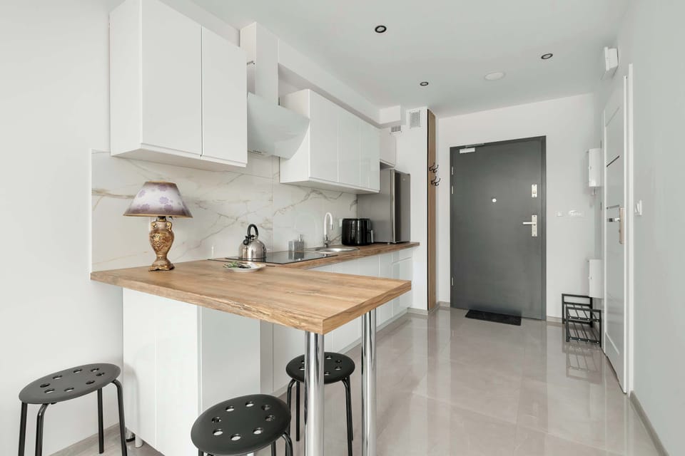 Compact kitchen space with modern appliances and utensils.