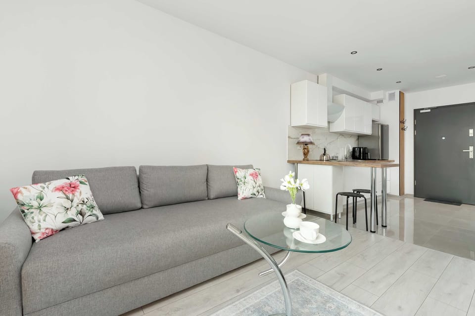 Spacious living area with comfortable seating and natural light.
