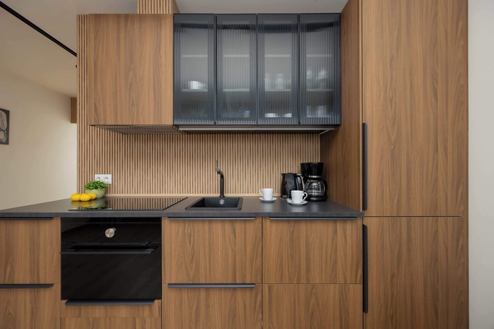 Kitchen close-up showing cabinets, coffee machine, and countertop.

