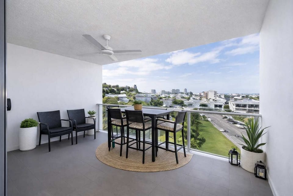 Private balcony with outdoor seating and city views