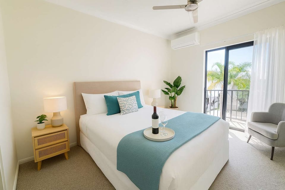 Hotel-quality master bedroom with plush bedding