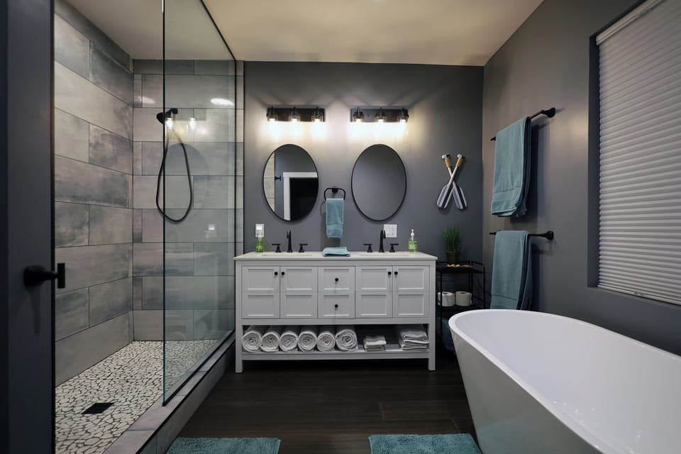 Master bedroom featuring closet workspace, balcony, and large en suite bath.
