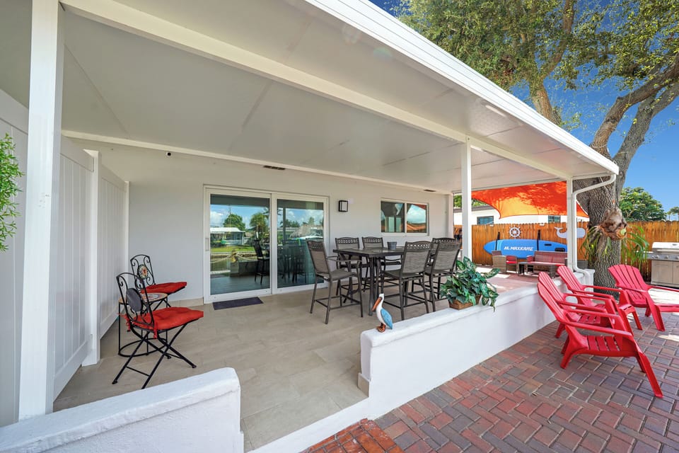 Shaded outdoor workspace with water views—work, read, or relax in nature's calm.